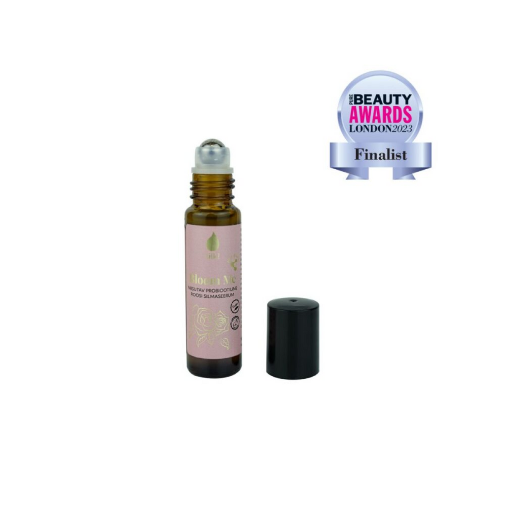 Tilk probiotic rose eye serum in a small brown roller bottle with black cap and award finalist badge