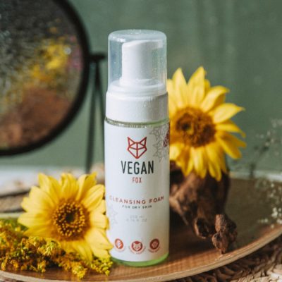 Vegan Fox vegan cleansing foam for dry skin in white pump bottle with yellow flowers background