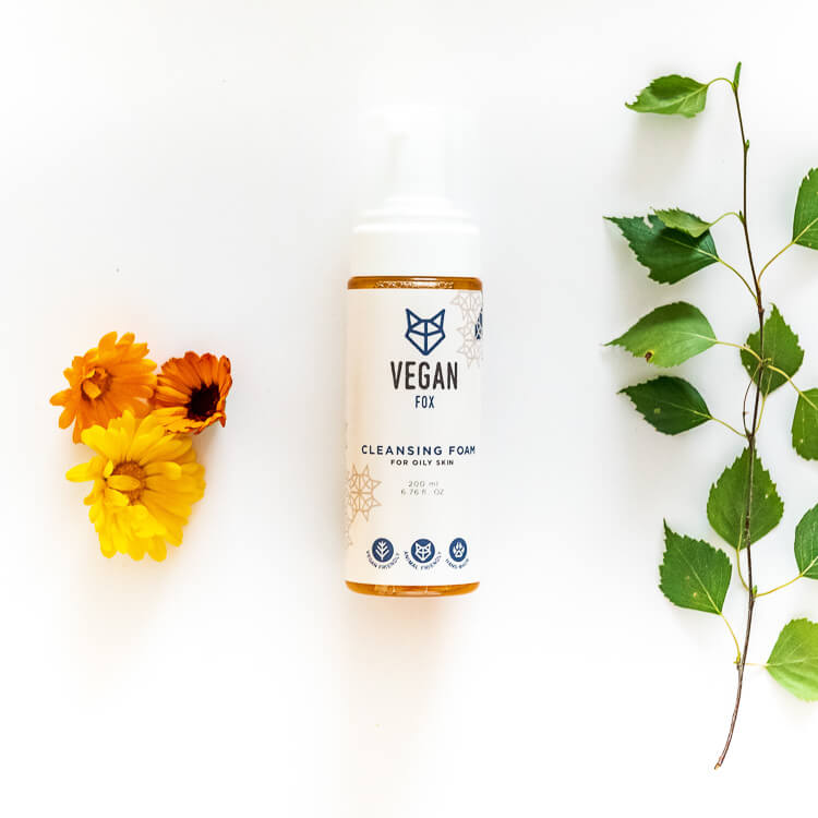Vegan Fox vegan cleansing foam for oily skin in white bottle with flowers and green leaves on white background