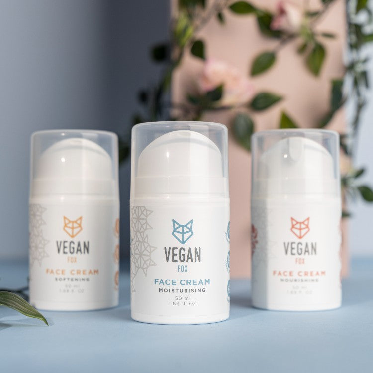 Vegan Fox vegan moisturizing face cream in white pump bottles with floral background